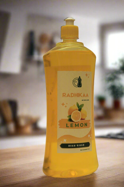 Yellow bottle of dishwashing liquid with lemon flavor on a white background